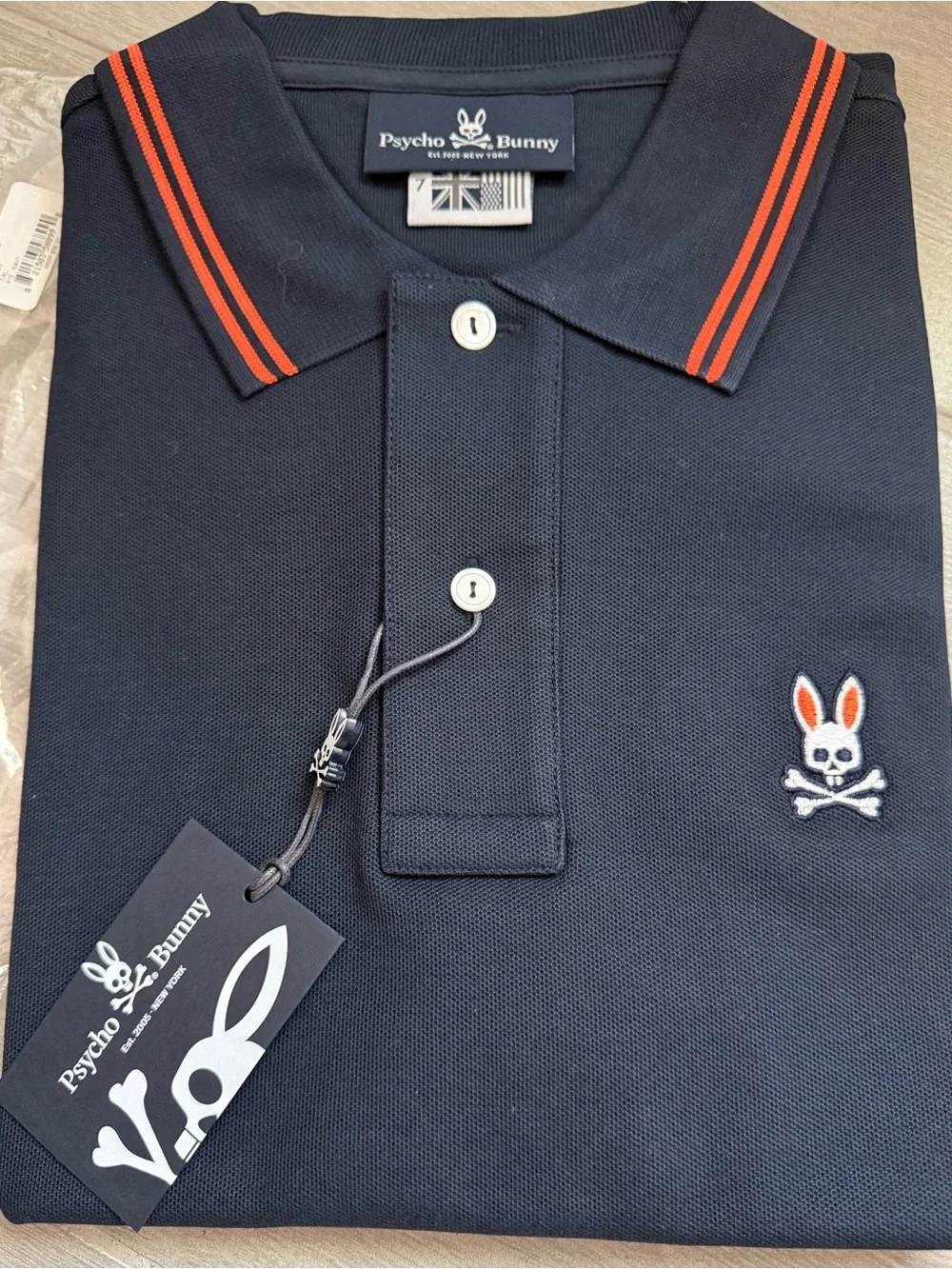 BRAND NEW… in bag…Psycho Bunny Navy Polo with Orange Trim - Picture 1 of 3